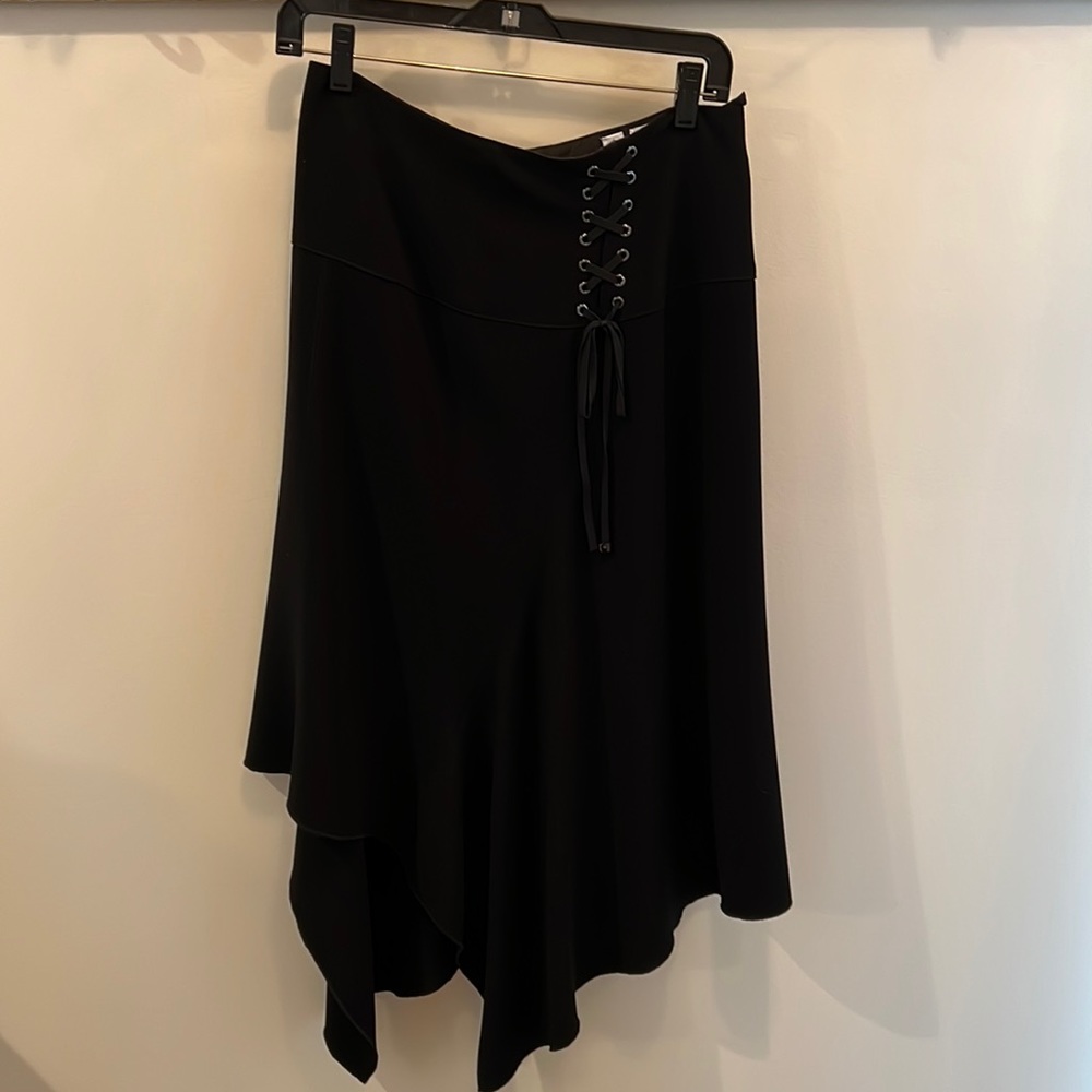 Black asymmetrical skirt with lacing detail at waist